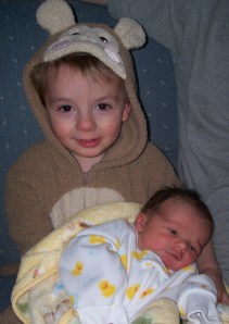 "I must hold that baby!" says our Monkey boy.